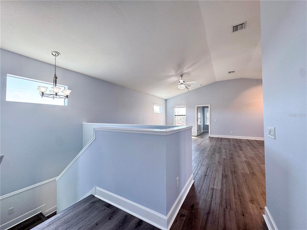 12822 Del Corso Loop Bradenton, FL 34211 - Photo 33 of 58 a view of empty room with wooden floor