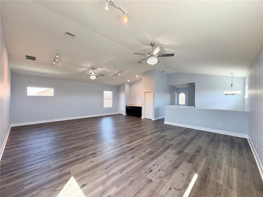 12822 Del Corso Loop Bradenton, FL 34211 - Photo 35 of 58 a view of an empty room with window and wooden floor