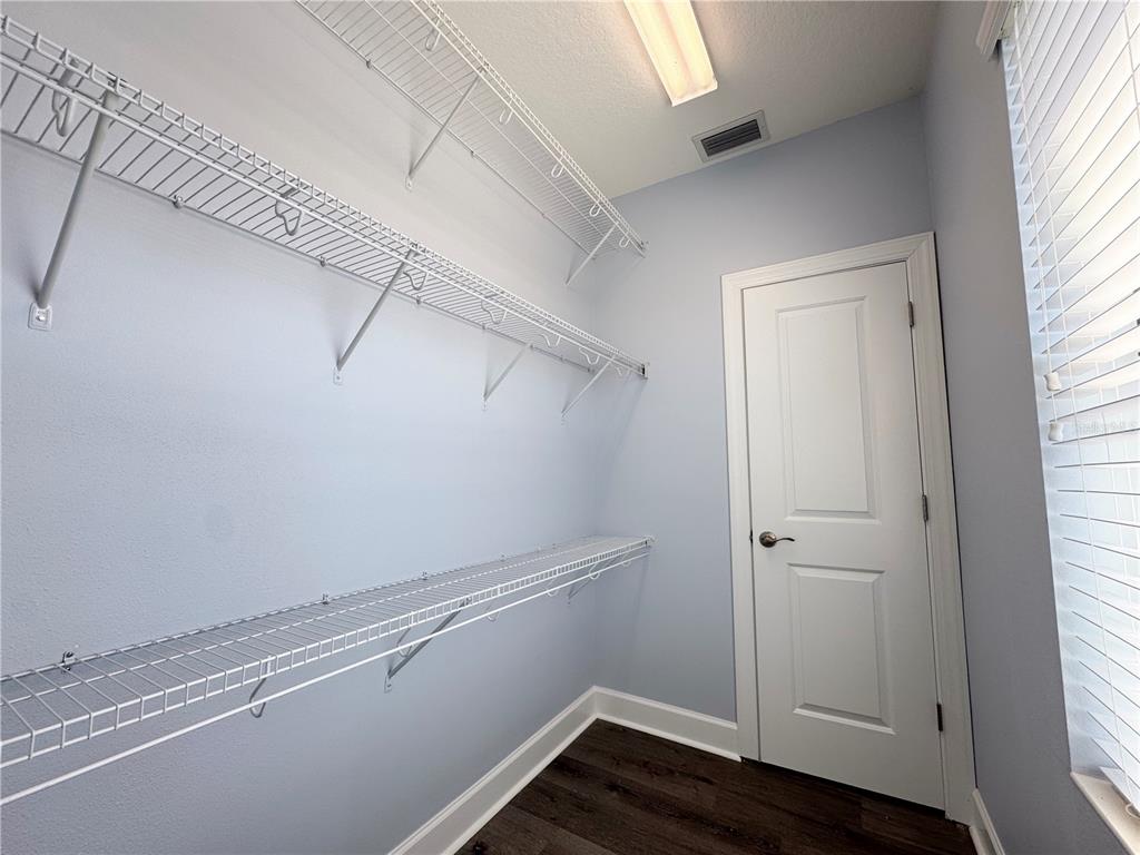 12822 Del Corso Loop Bradenton, FL 34211 - Photo 44 of 58 a view of a room with racks on the wall