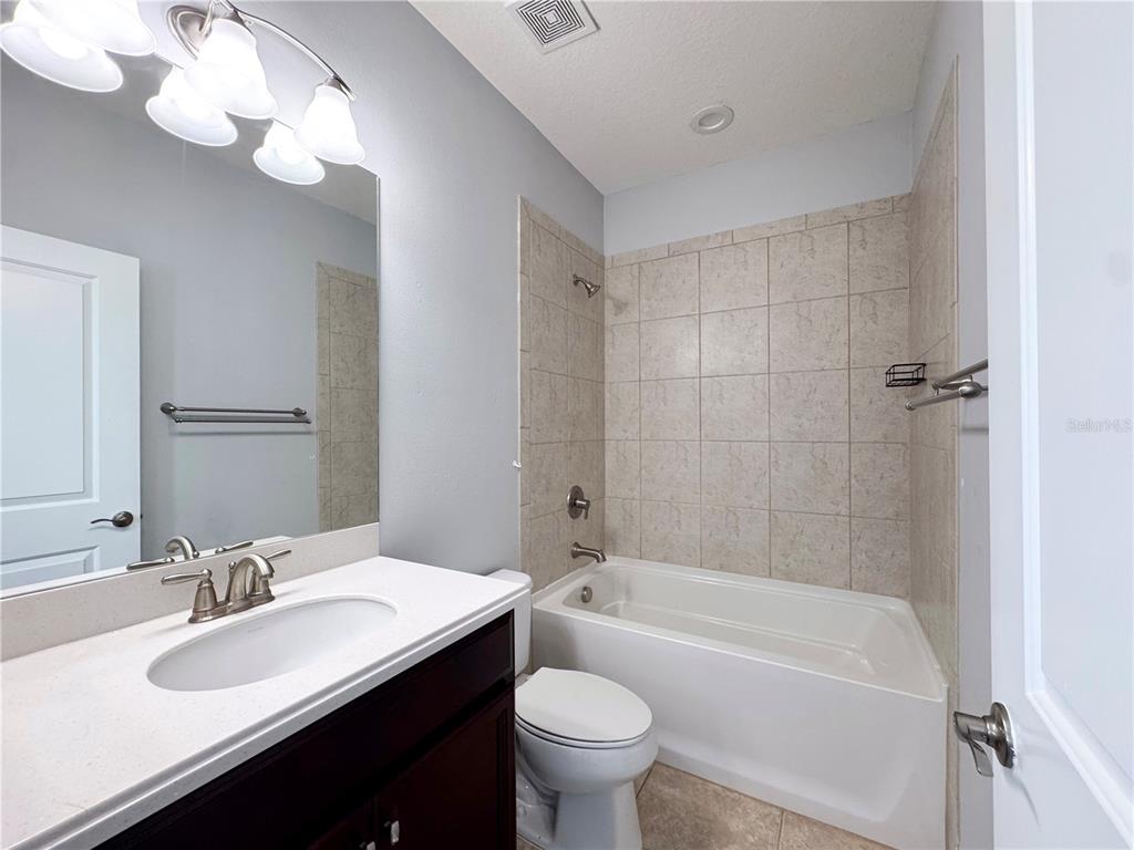 12822 Del Corso Loop Bradenton, FL 34211 - Photo 45 of 58 a bathroom with a bathtub a sink and a toilet