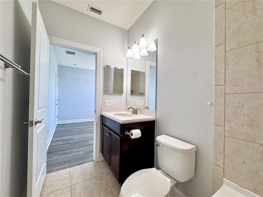 12822 Del Corso Loop Bradenton, FL 34211 - Photo 46 of 58 a bathroom with a sink toilet and shower
