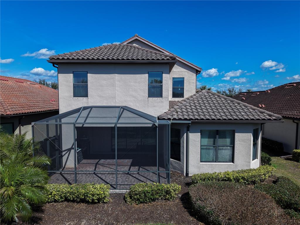 12822 Del Corso Loop Bradenton, FL 34211 - Photo 53 of 58 a front view of a house with garden