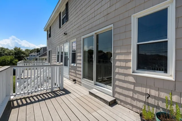 a view of a balcony with wooden floor
