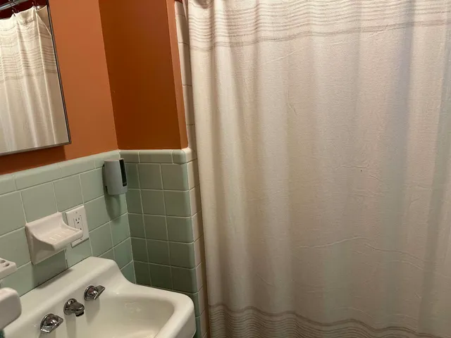 a bathroom with a sink and toilet