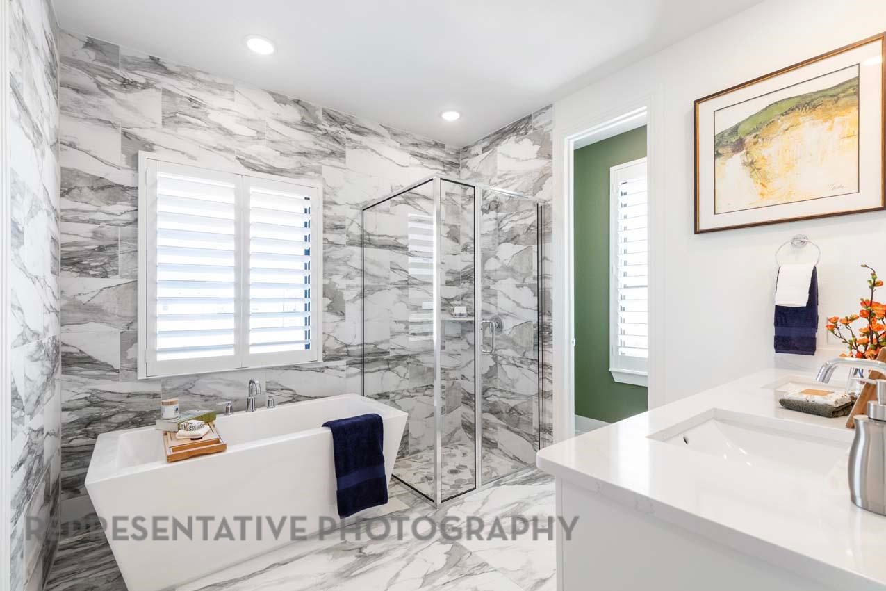 5411 Bonfire Alley Manvel, TX 77578 - Photo 12 of 21 a bath room with a sink and a bath tub