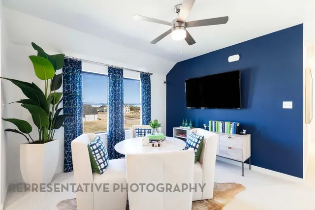 a living room with furniture and a flat screen tv