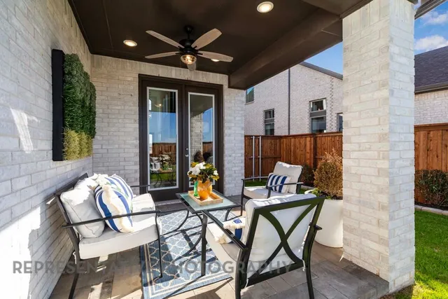 a view of an outdoor dining space with a table and chairs
