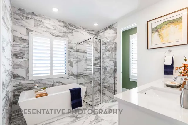 a bath room with a sink and a bath tub