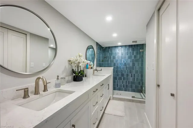 a bathroom with a double vanity sink and a mirror