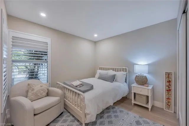 a bedroom with a bed and a couch