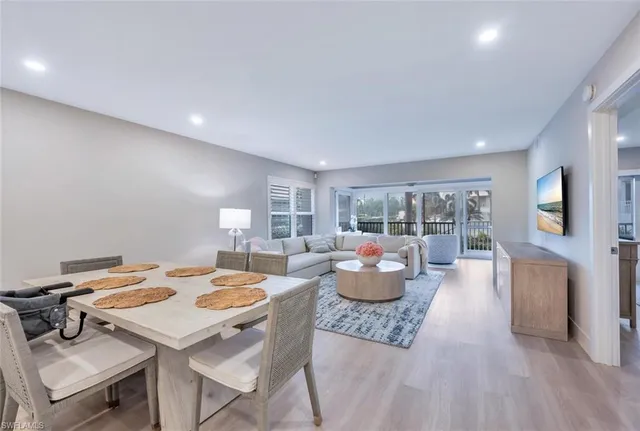 a living room with fireplace furniture and a table