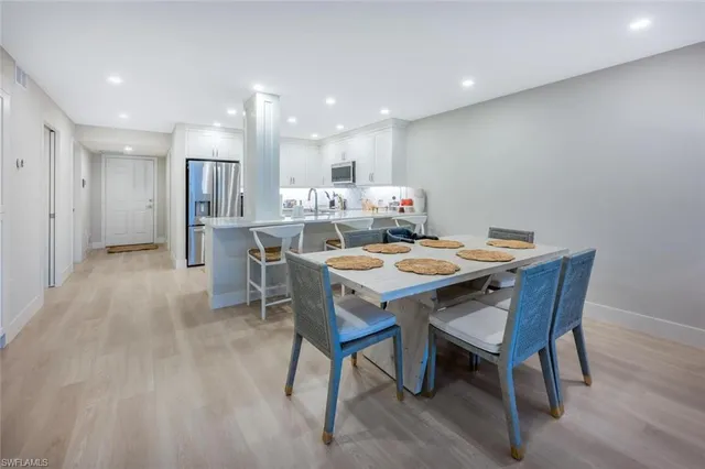 a dining room with a table and chairs