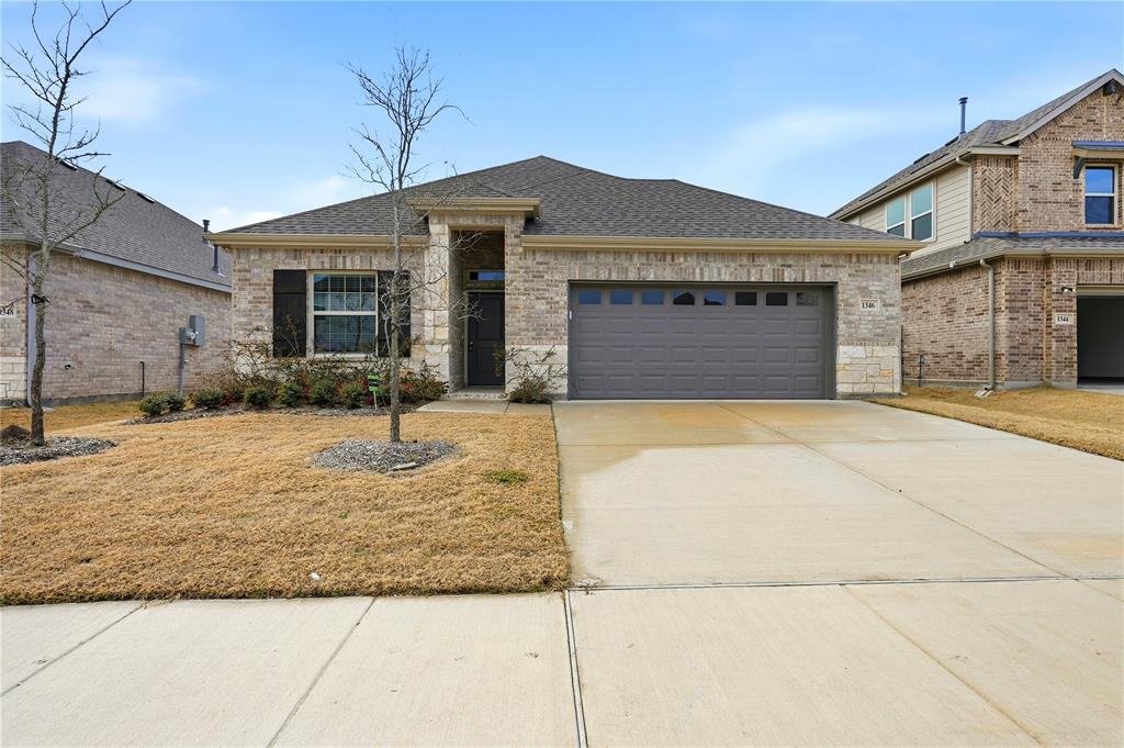 a front view of a house with yard