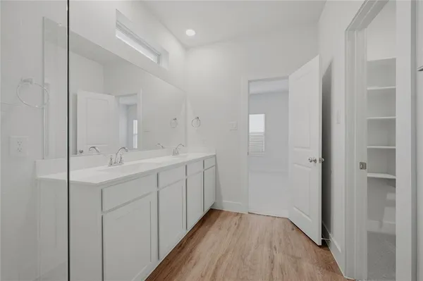 a bathroom with a sink and mirror