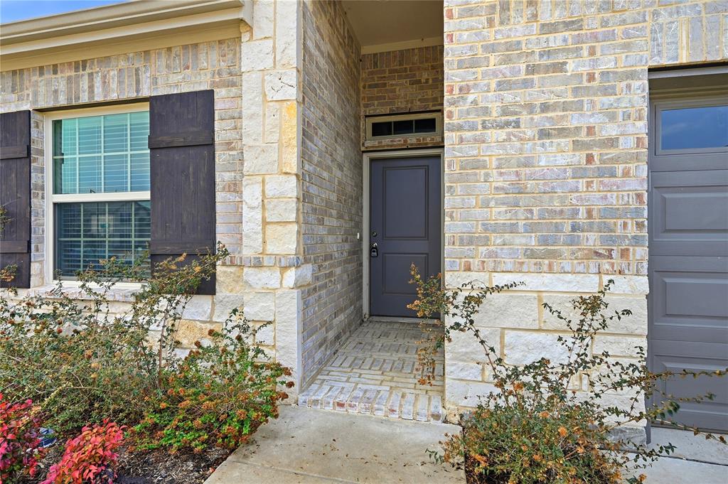 1346 Chisos Way Forney, TX 75126 - Photo 4 of 40 a front view of a house with a garden
