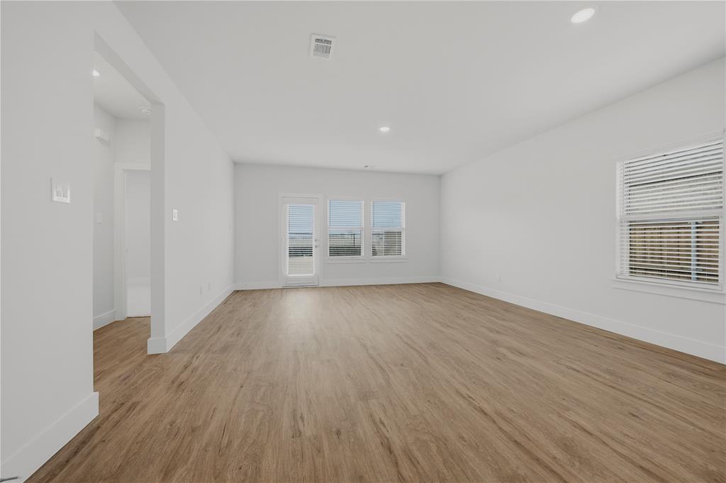 1346 Chisos Way Forney, TX 75126 - Photo 6 of 40 wooden floor in an empty room with a window