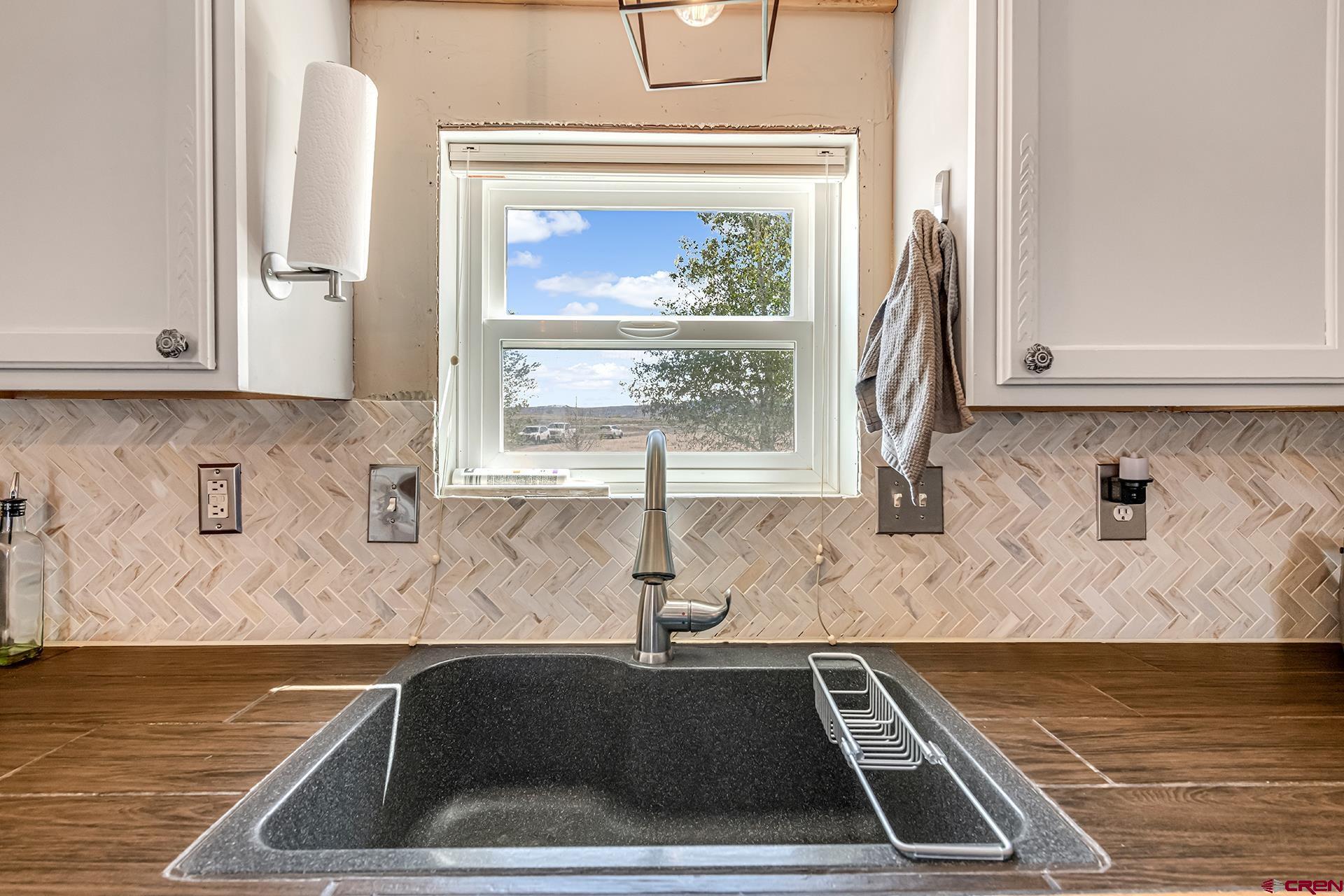 2787 2100th Road Delta, CO 81416 - Photo 13 of 40 a kitchen with a sink and a window