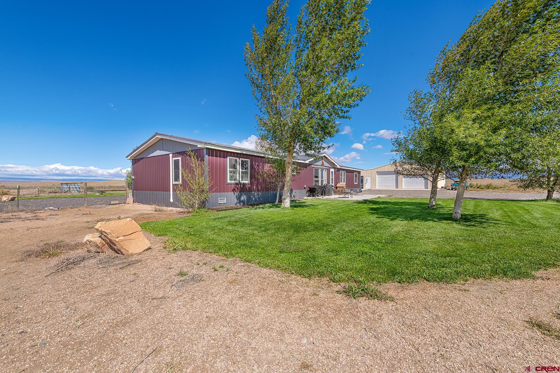 2787 2100th Road Delta, CO 81416 - Photo 2 of 40 a view of a house with a yard