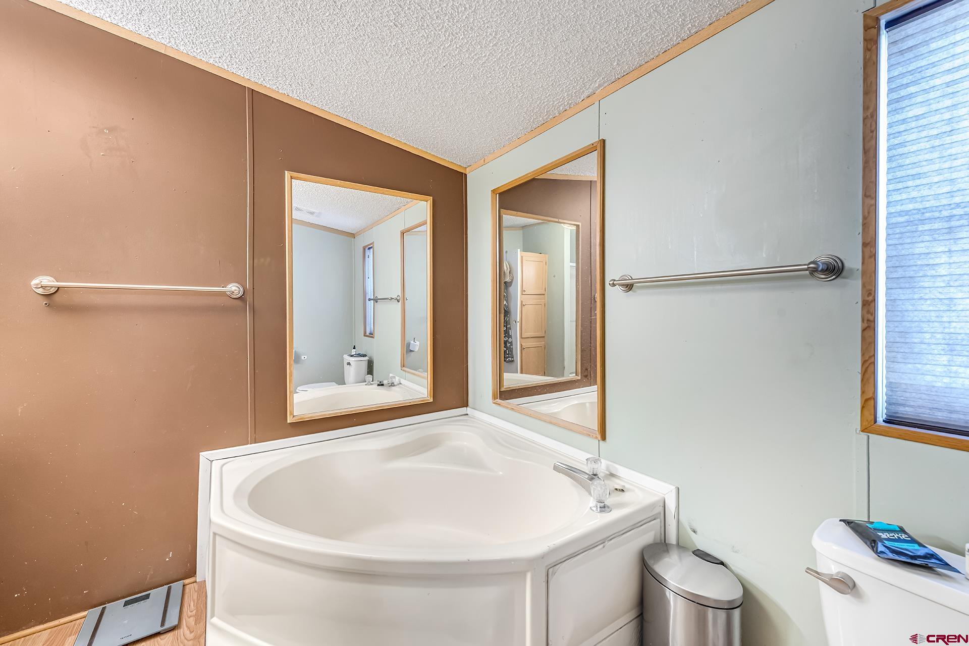 2787 2100th Road Delta, CO 81416 - Photo 23 of 40 a bathroom with a sink and a mirror