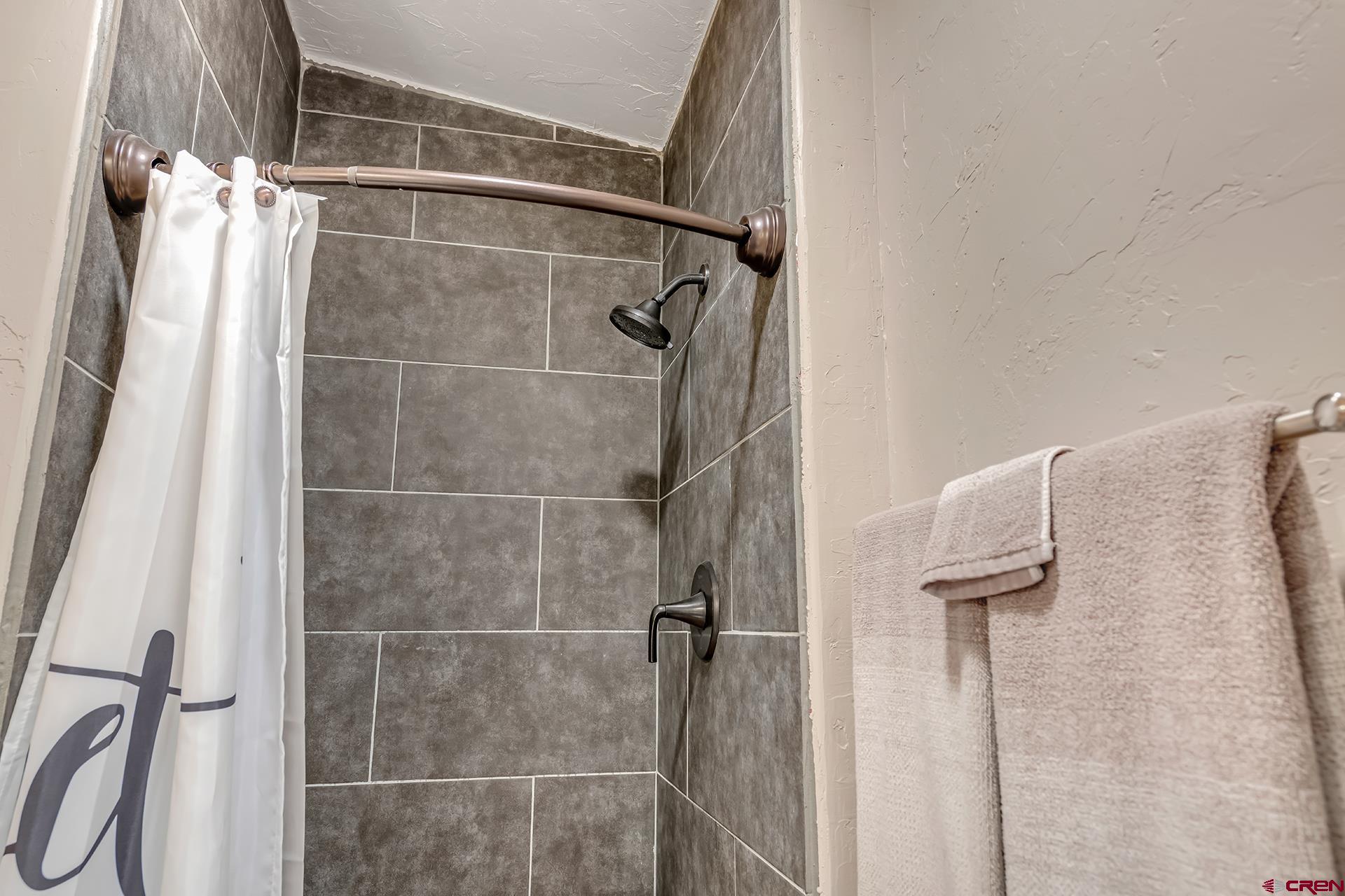 2787 2100th Road Delta, CO 81416 - Photo 26 of 40 a bathroom with a shower