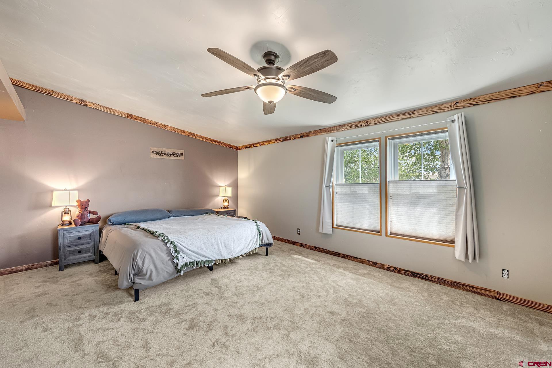 2787 2100th Road Delta, CO 81416 - Photo 29 of 40 a bed room with a bed and a window