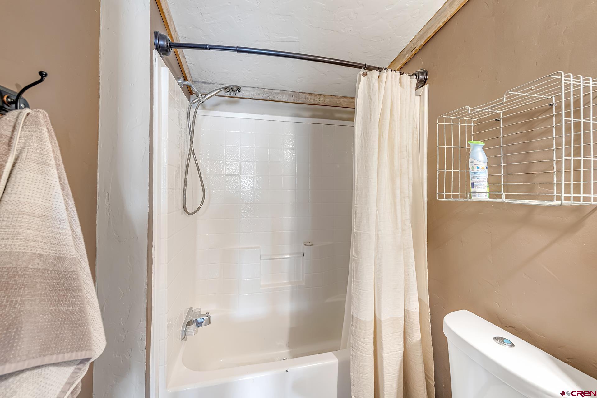2787 2100th Road Delta, CO 81416 - Photo 31 of 40 a bathroom with a shower and a toilet