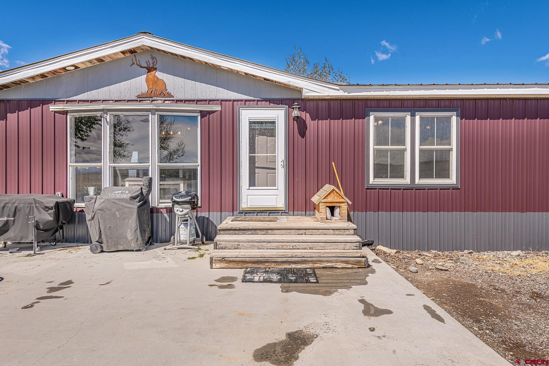 2787 2100th Road Delta, CO 81416 - Photo 4 of 40 a front view of a house with a outdoor space
