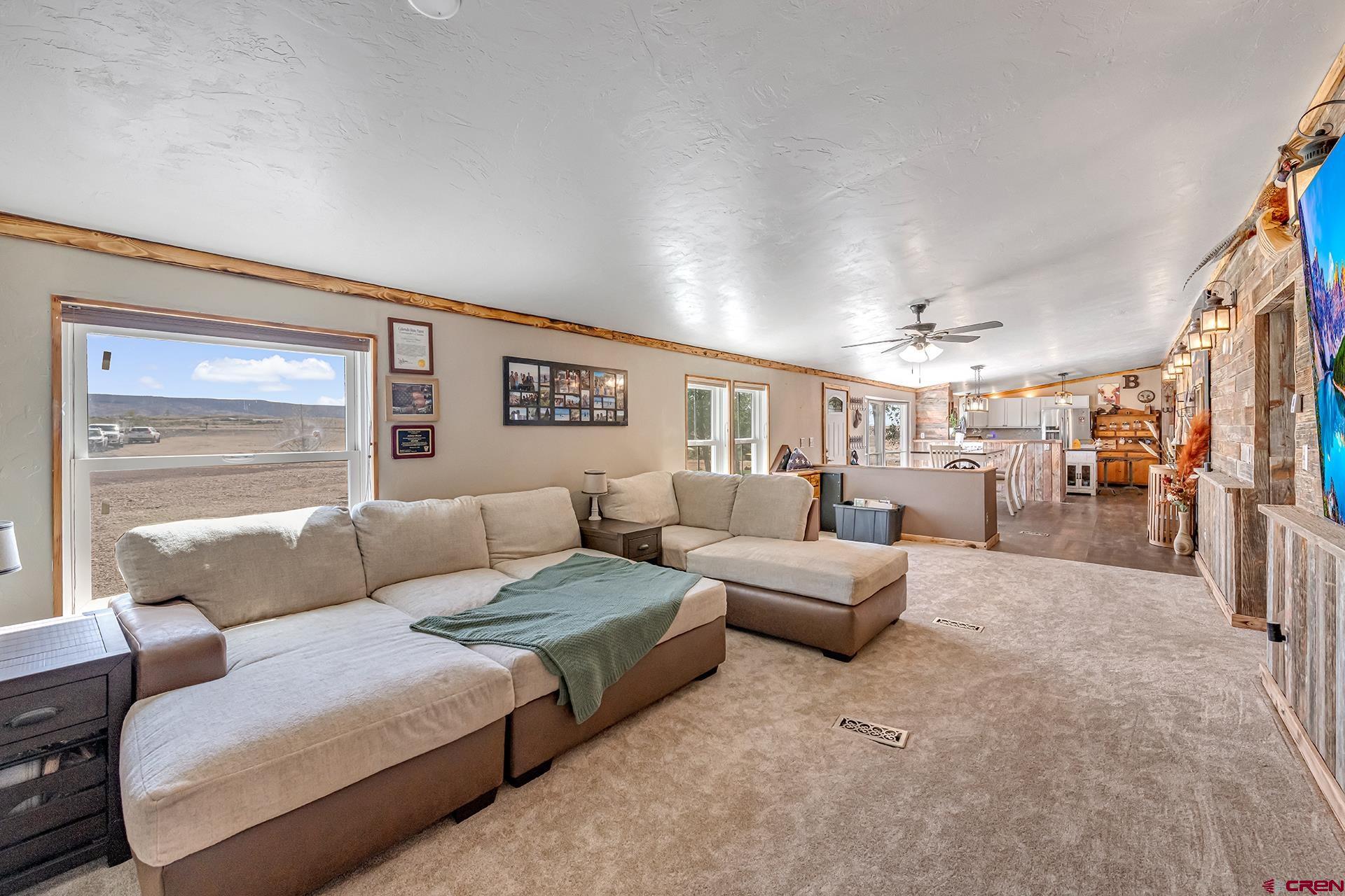 2787 2100th Road Delta, CO 81416 - Photo 6 of 40 a living room with furniture and a table