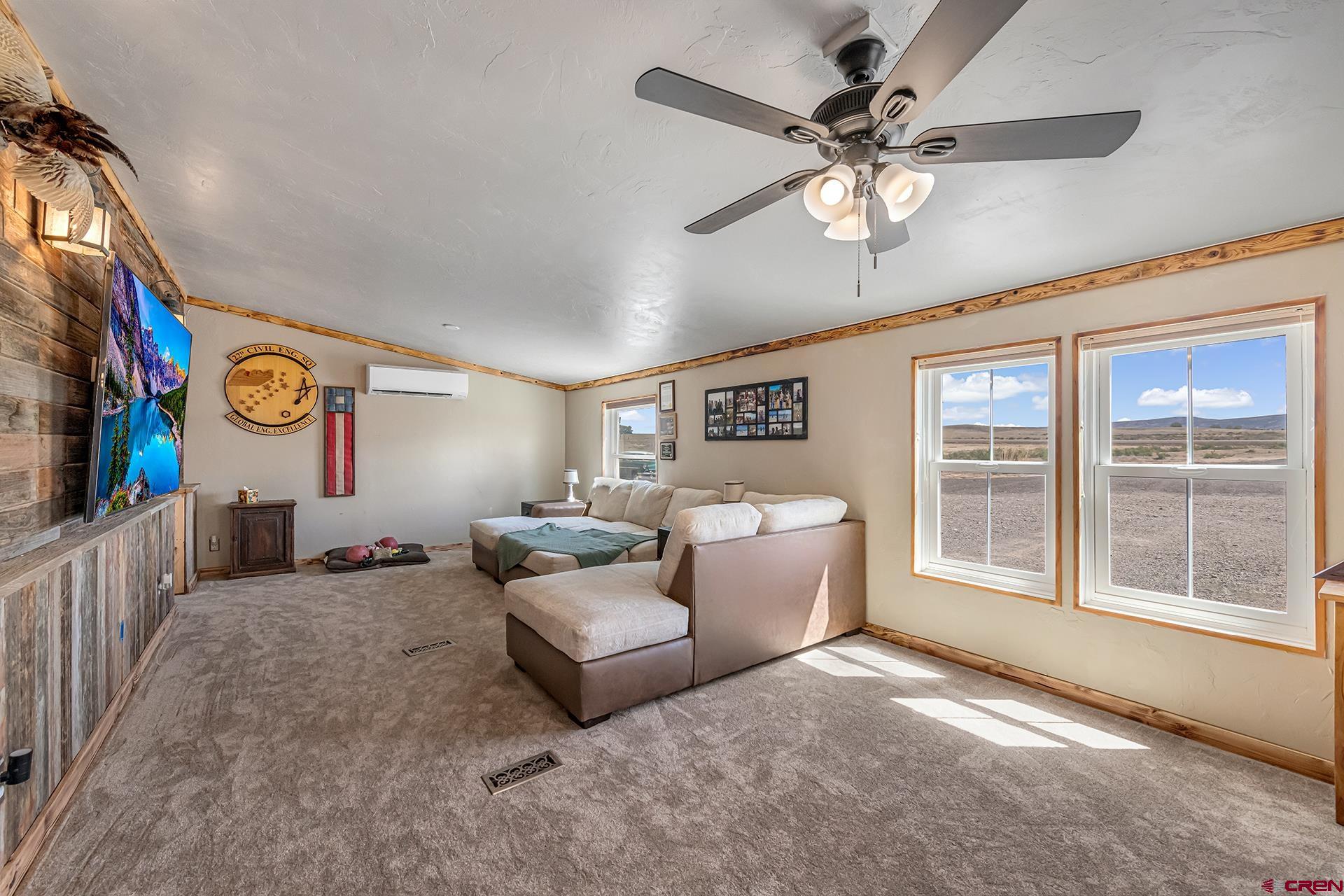 2787 2100th Road Delta, CO 81416 - Photo 8 of 40 a living room with furniture and a large window