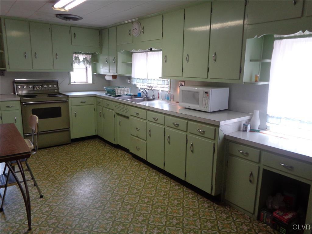 8367 Rextown Road Slatington, PA 18080 - Photo 3 of 21 a kitchen with cabinets a sink and appliances