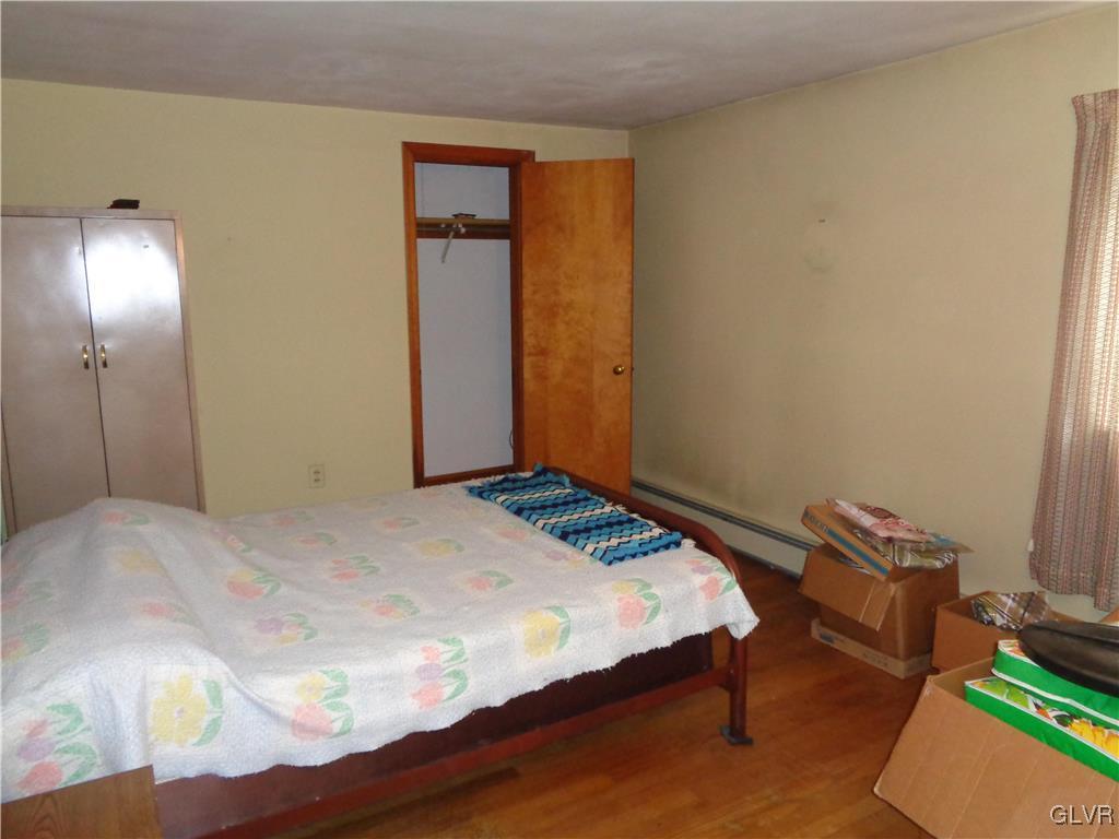 8367 Rextown Road Slatington, PA 18080 - Photo 6 of 21 a bedroom with a bed and wooden floor