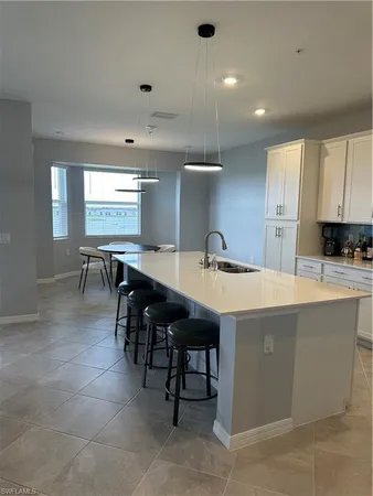 a kitchen with a table and chairs in it