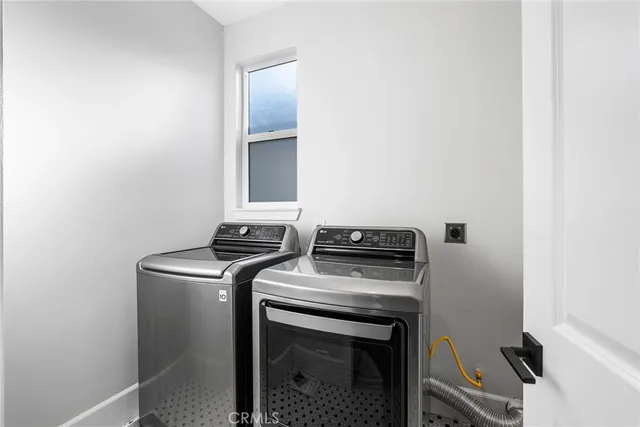 an aerial view of residential houses with city view