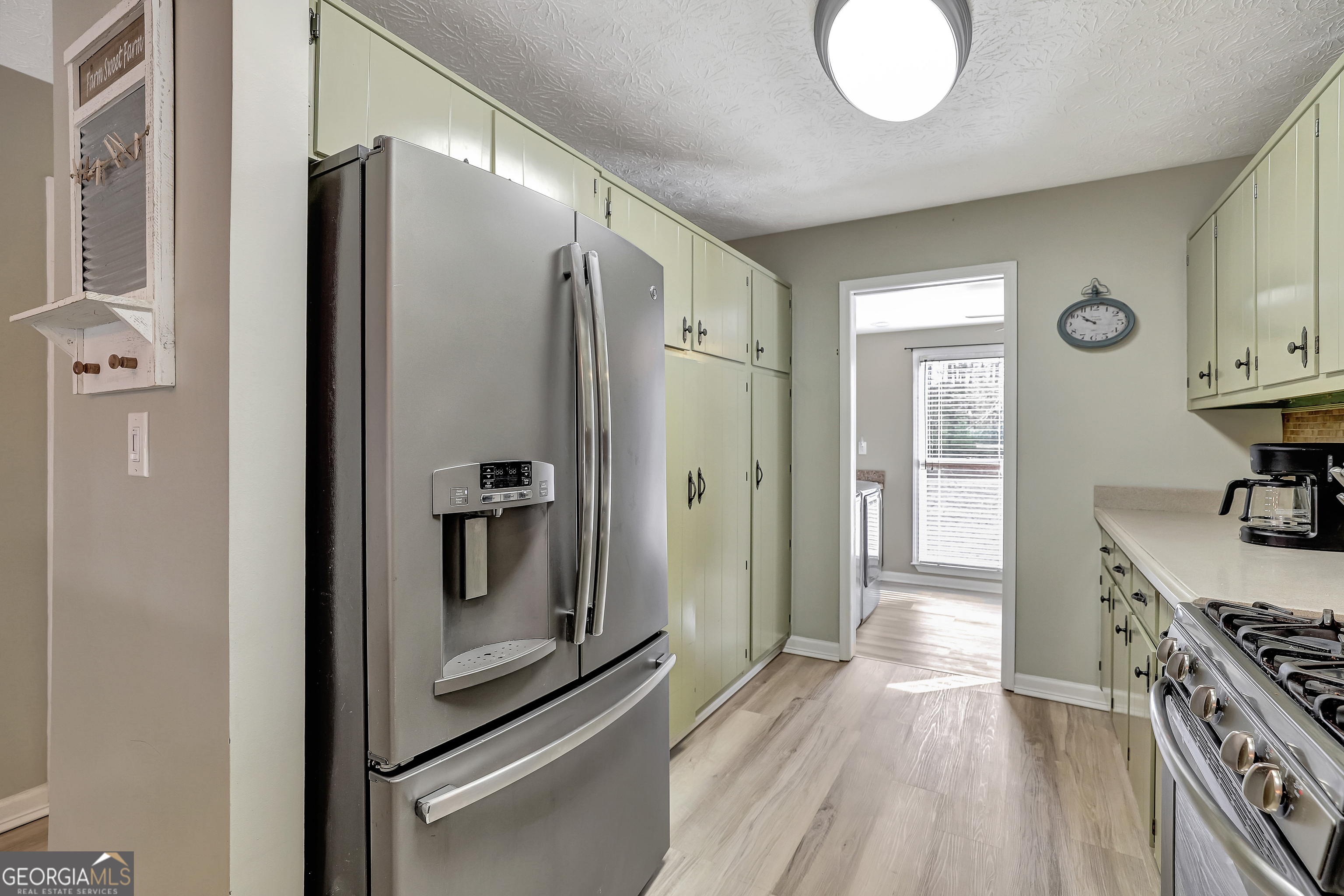 300 Briarwood Road Tyrone, GA 30290 - Photo 16 of 74 a kitchen with stainless steel appliances granite countertop a refrigerator and a stove