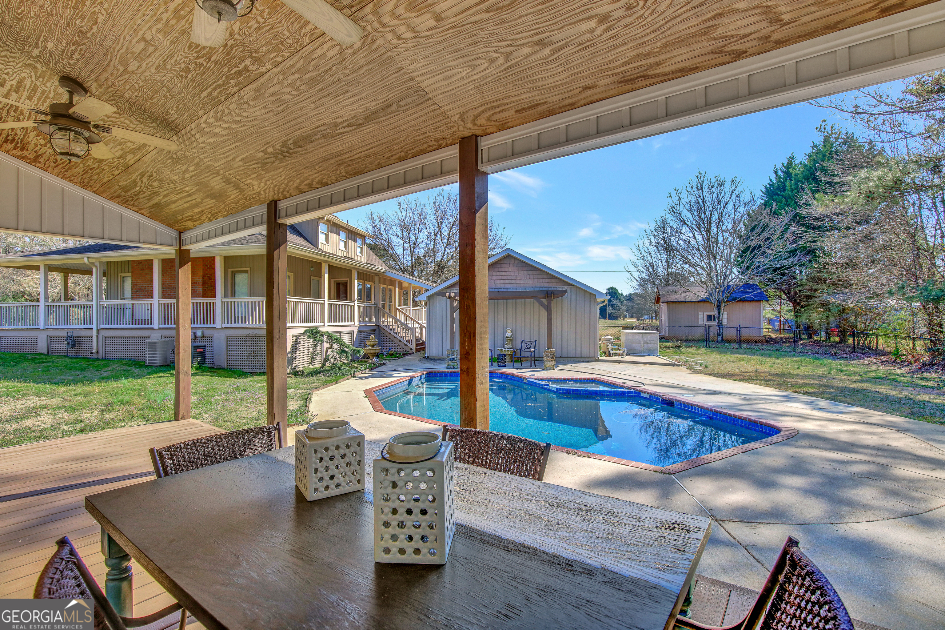 300 Briarwood Road Tyrone, GA 30290 - Photo 53 of 74 a view of house with swimming pool yard fire pit and outdoor seating