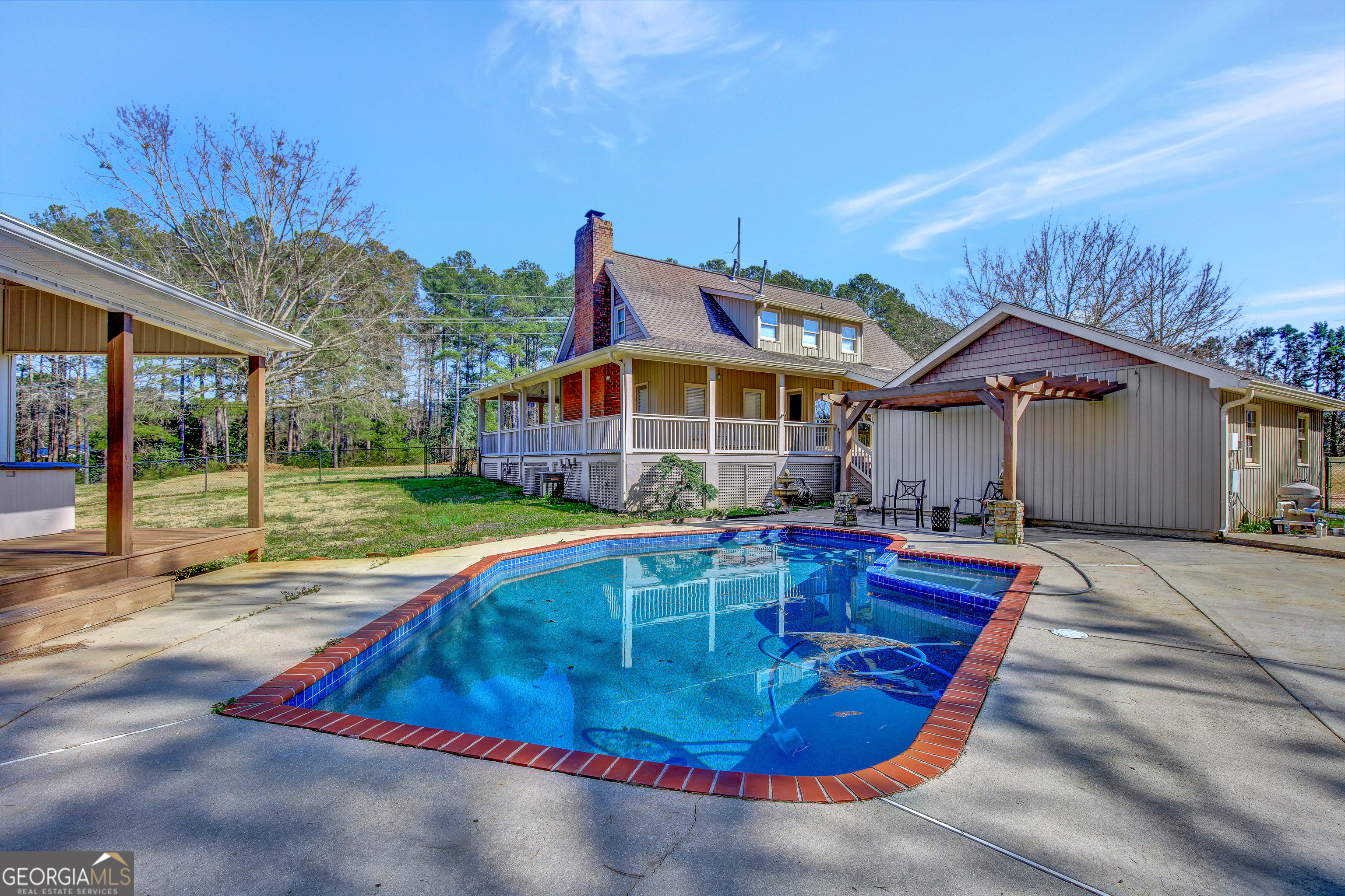 300 Briarwood Road Tyrone, GA 30290 - Photo 54 of 74 a view of a house with swimming pool