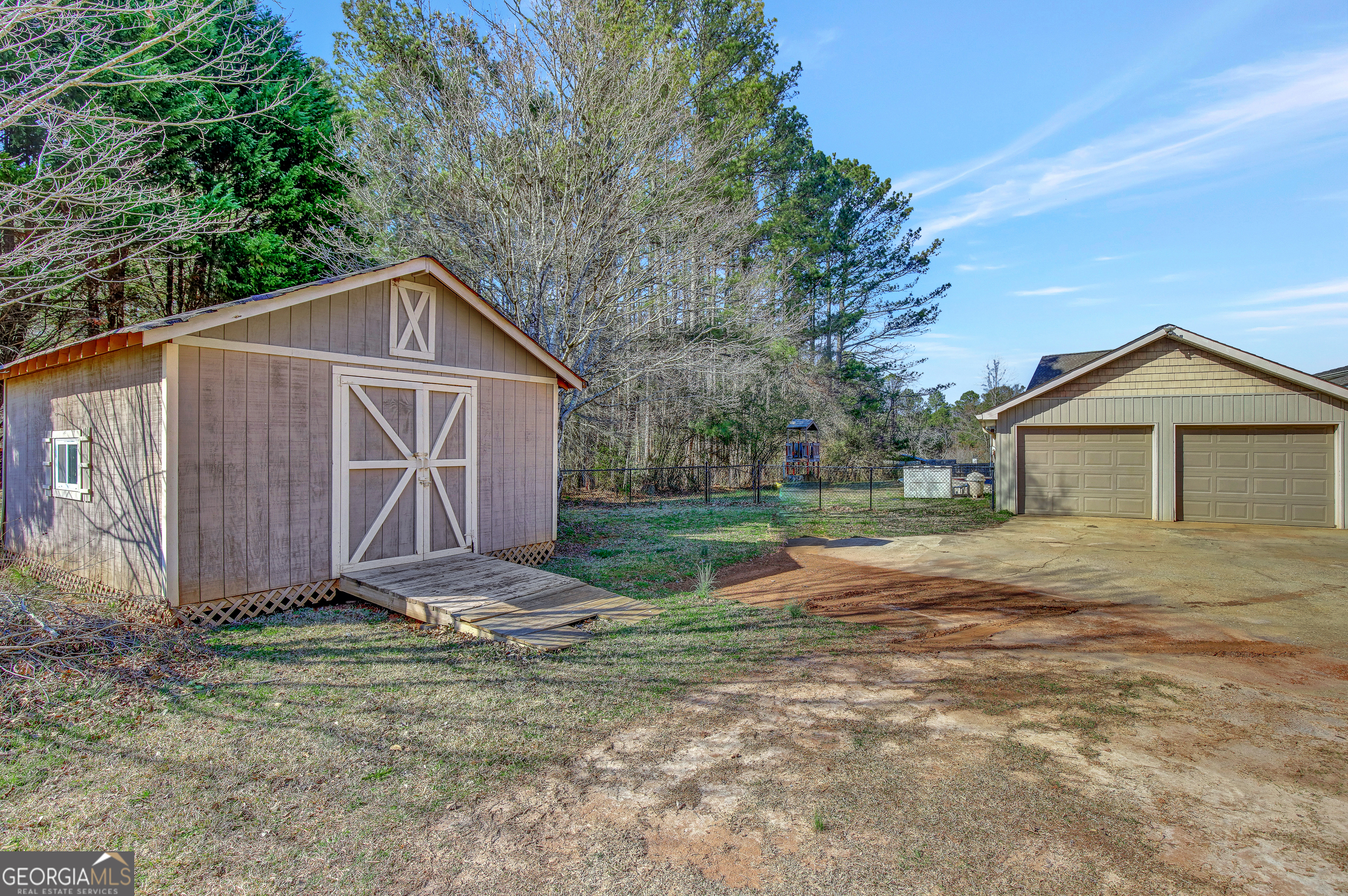300 Briarwood Road Tyrone, GA 30290 - Photo 56 of 74 a view of backyard of house with garage