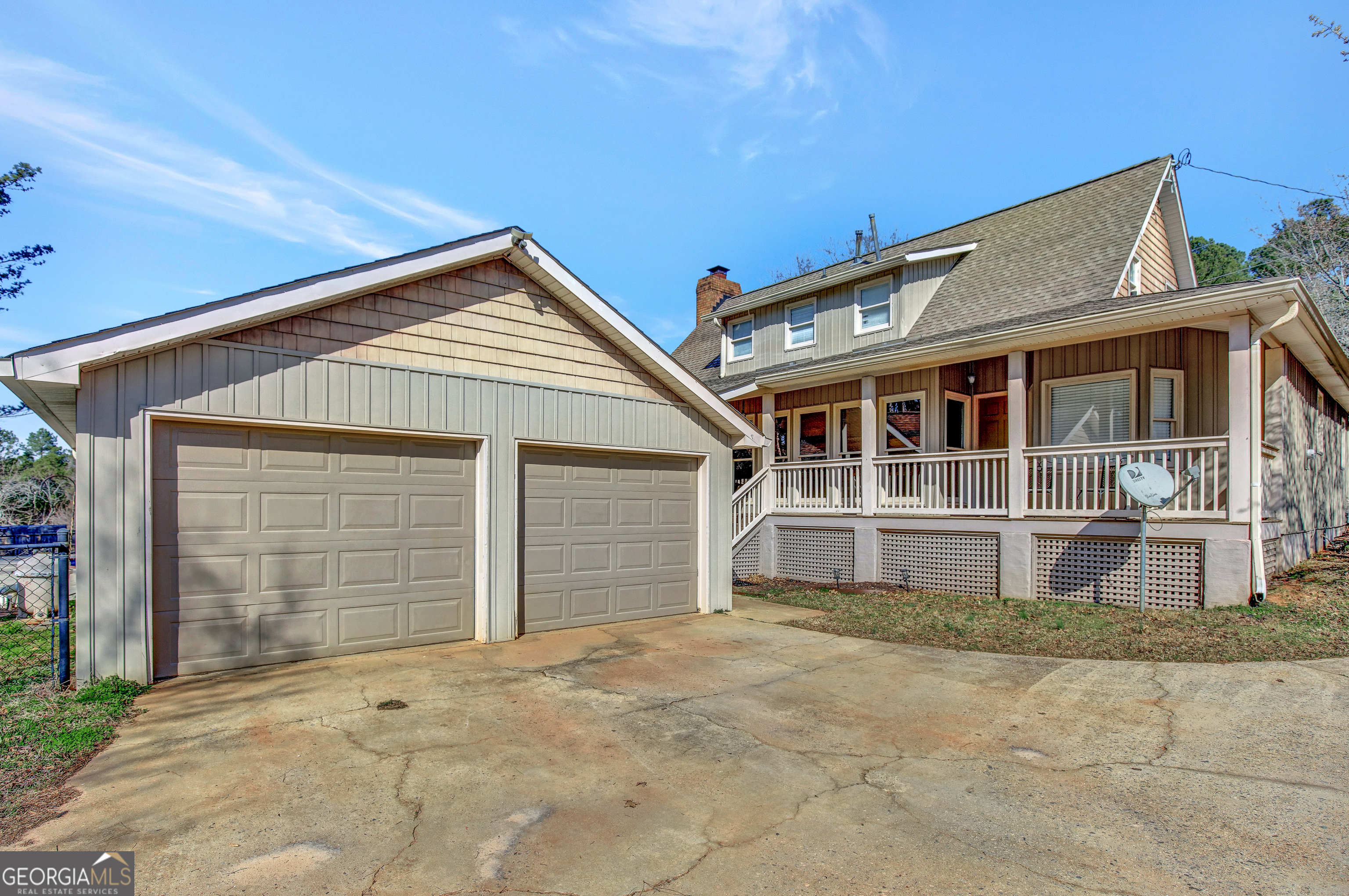 300 Briarwood Road Tyrone, GA 30290 - Photo 57 of 74 a front view of a house with a yard and garage