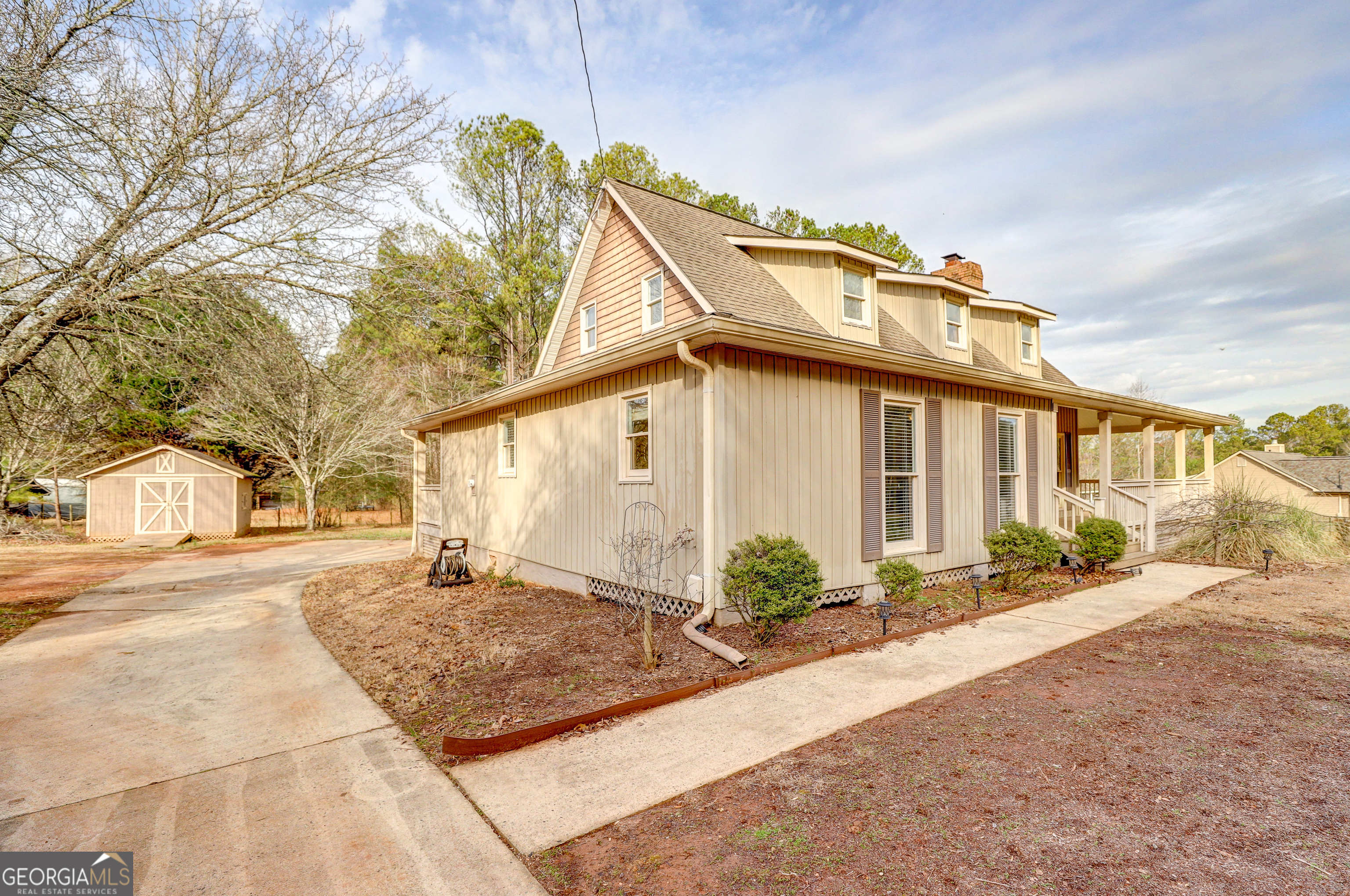 300 Briarwood Road Tyrone, GA 30290 - Photo 65 of 74 a front view of a house with a yard and potted plants