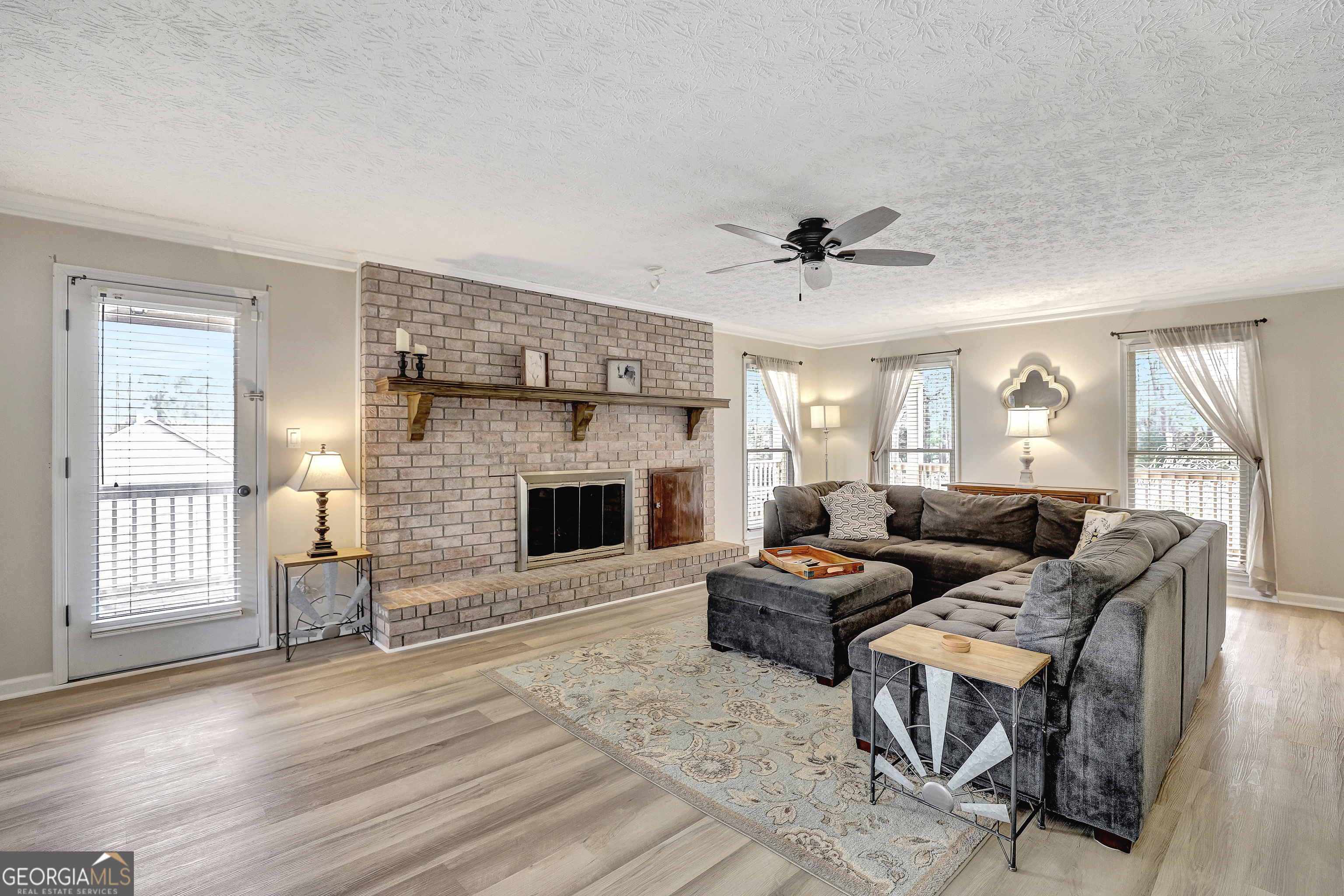 300 Briarwood Road Tyrone, GA 30290 - Photo 9 of 74 a living room with furniture and a fireplace