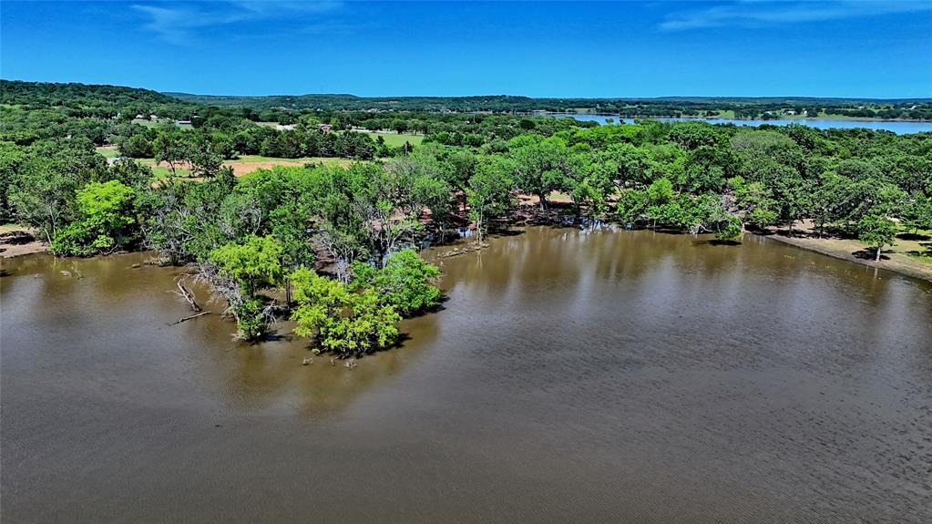 Tbd Selma Road Bowie, TX 76230 - Photo 2 of 18 a view of a lake with beach and outdoor space