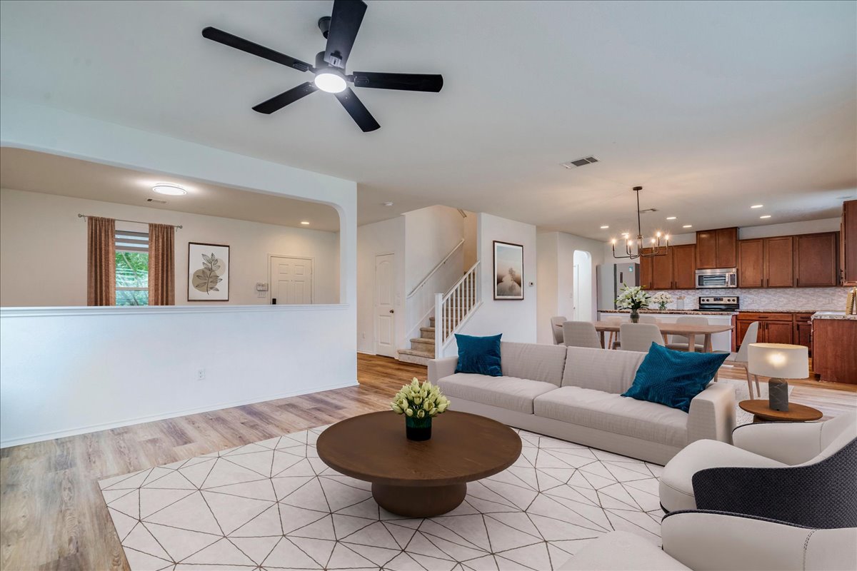 401 Waterleaf Boulevard Kyle, TX 78640 - Photo 9 of 28 Open living area with new floors