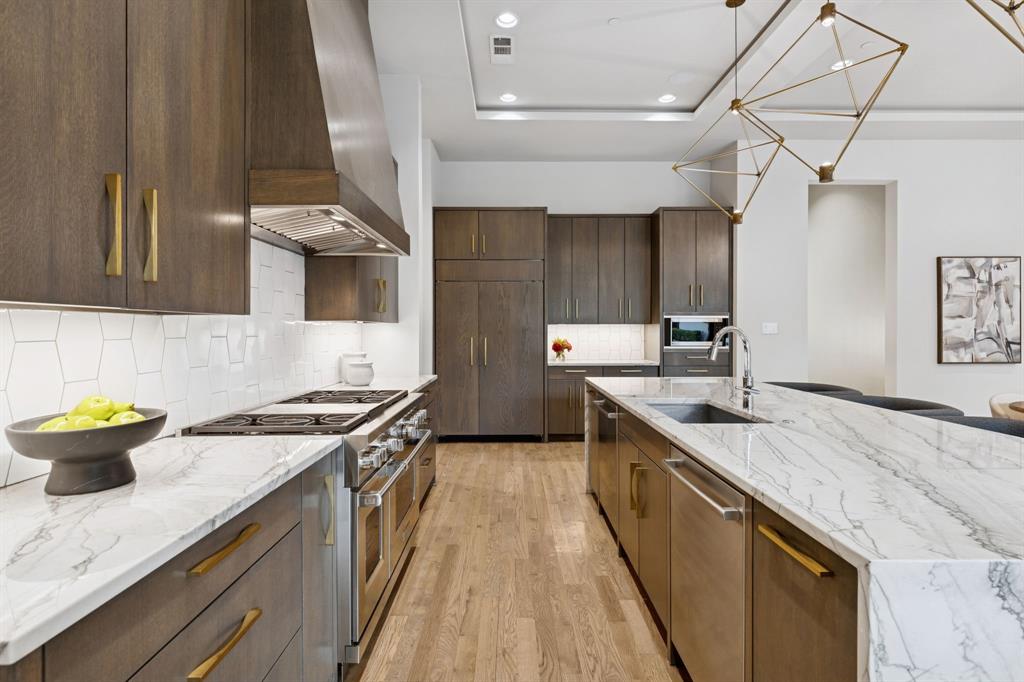 4447 Taos Road Dallas, TX 75209 - Photo 15 of 38 a kitchen with a sink and stove