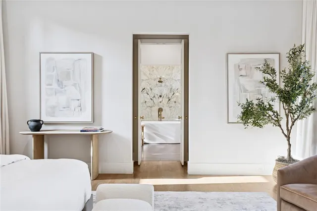 a bathroom with a bathtub and shower