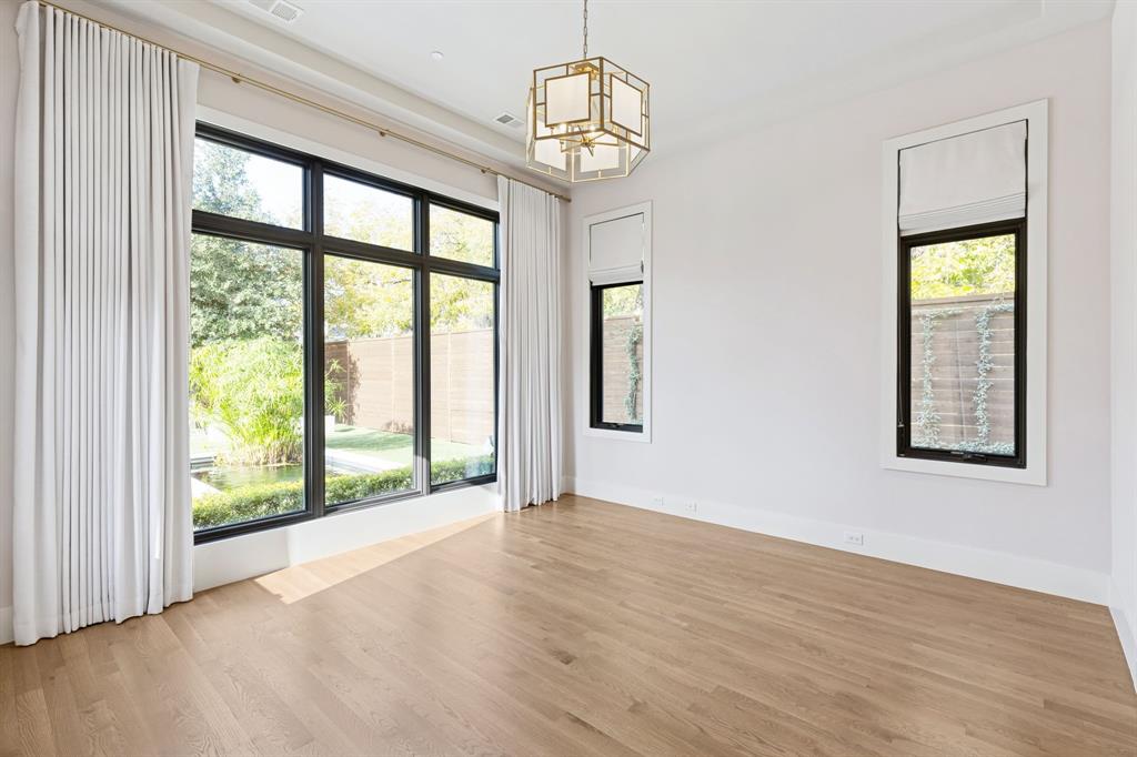 4447 Taos Road Dallas, TX 75209 - Photo 23 of 38 wooden floor in an empty room with a window