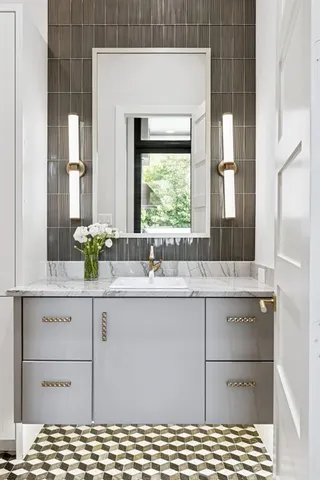 a kitchen with sink and large window