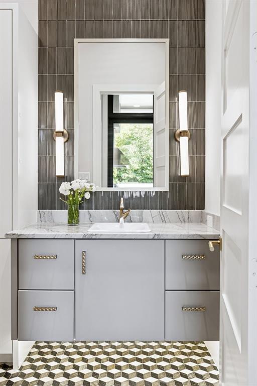 4447 Taos Road Dallas, TX 75209 - Photo 24 of 38 a bathroom with a sink and a mirror