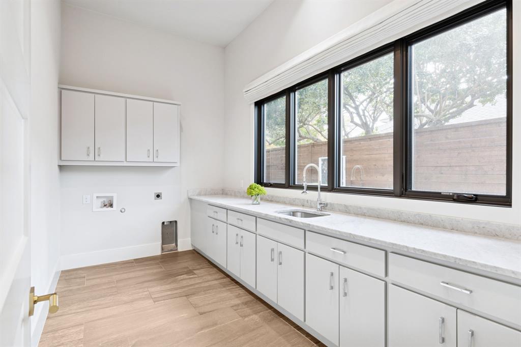 4447 Taos Road Dallas, TX 75209 - Photo 25 of 38 a kitchen with sink and large window
