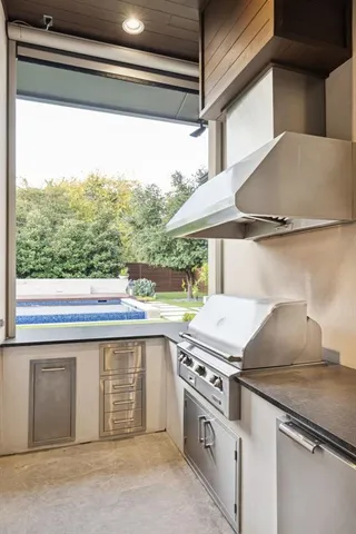 a view of a swimming pool with a yard