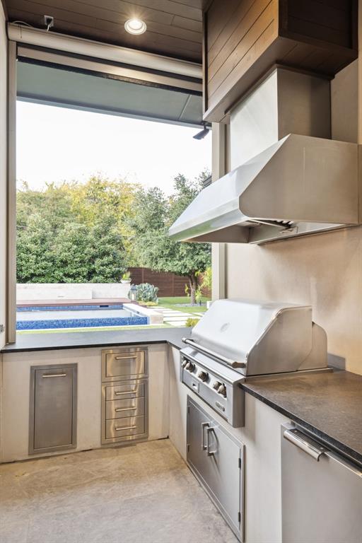 4447 Taos Road Dallas, TX 75209 - Photo 30 of 38 a kitchen with a stove and a window